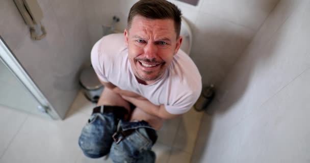 Young Happy Man Sits Toilet Smiles Irritable Bowel Syndrome Symptoms — Stockvideo