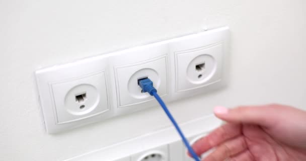 Closeup Woman Hand Takes Out Network Cable Wall Socket Network — Stock Video