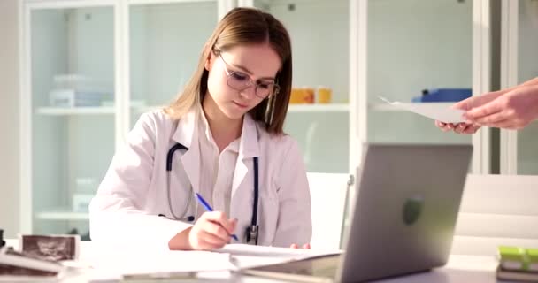 Female Practitioner Signs Documents Hands Patient Registration Medical Documents Insurance — Vídeo de Stock