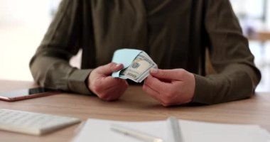 Woman hands count dollars in envelope at workplace. Consequences for employee receiving salary in envelope and criminal liability for employer