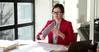 Tired pensive woman with help inscription at workplace. Help and advice from a business consultant