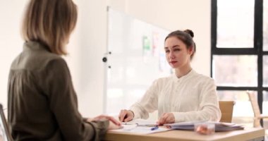 Irritated business woman holding paper does not agree with bad terms of contract. Boss CEO dissatisfied with report or written result of work