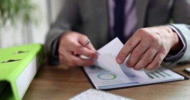 Man in business suit study business documents at workplace closeup. Concept of business marketing and data analysis