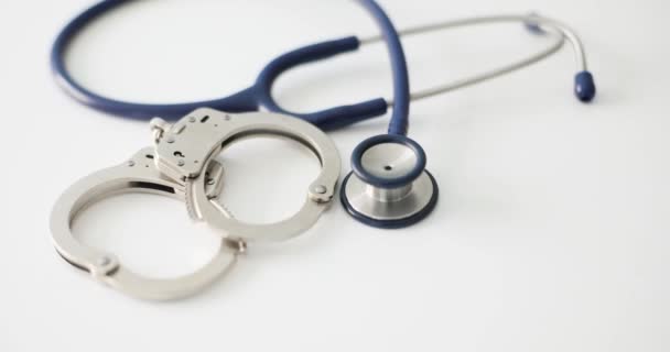 Stethoscope Handcuffs Medical Crimes Monetary Bribe Medical Malpractice Corruption Violation — Video Stock