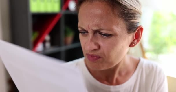 Dissatisfied Woman Reads Document Close Slowmotion Small Font Contract Unpleasant — Vídeos de Stock