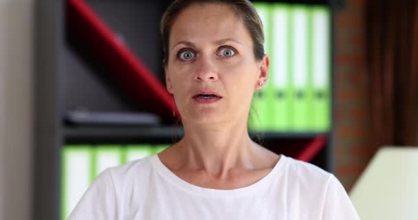 Frightened Young Woman Looks Her Fingers Close Slowmotion Concept Fear — Vídeos de Stock