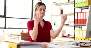 Tired businesswoman with closed eyes meditating in office 4k movie slow motion. Relax and yoga at work concept