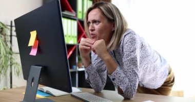 Shocked businesswoman looking at computer screen and swearing in office 4k movie slow motion. Online work difficulties concept