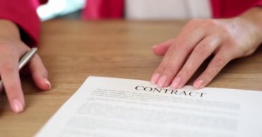 Businesswoman handing out documents with contract for signing to client closeup 4k movie slow motion. Work with partners concept