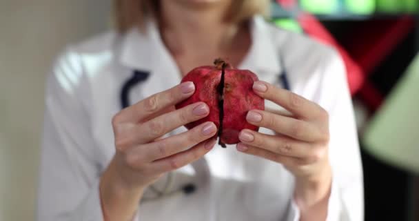 Doctor Nutritionist Breaking Pomegranate Fruit Two Halves Closeup Movie Slow — стоковое видео