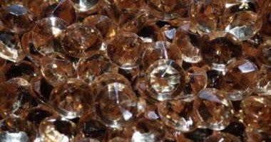 Large number of expensive genuine light brown diamonds. Professional methods for checking authenticity of gemstones concept
