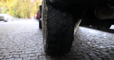 Off-road wheel for driving on off-road steppe adventure trail. 4x4 off-road racing and a selection of car tires
