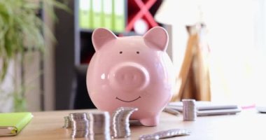 Piggy bank and stacks of coins is financial way to save money. Money insurance finance and budget