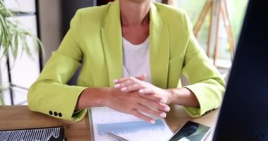 Female hands making victory hand gesture in front of computer. Manager boss receiving long awaited message and positive results of online lottery betting