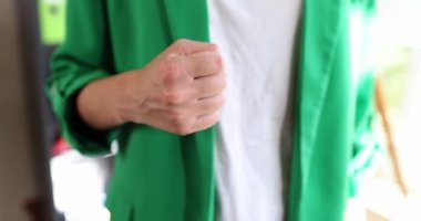Woman hands gesticulate with stone paper scissors. Choice and decision gesture