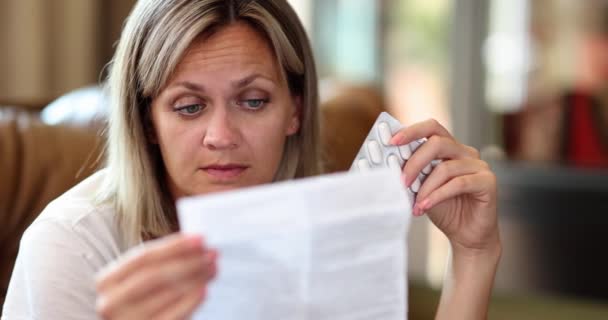 Woman Carefully Reads Instructions Medical Pills Sick Woman Looking Medication — Vídeo de stock