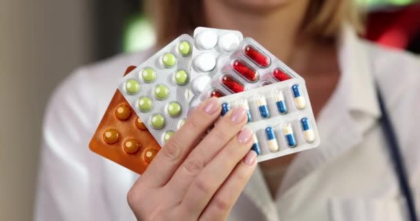 Hand Female Doctor Holds Pack Various Pill Blisters Directory Drugs — Wideo stockowe