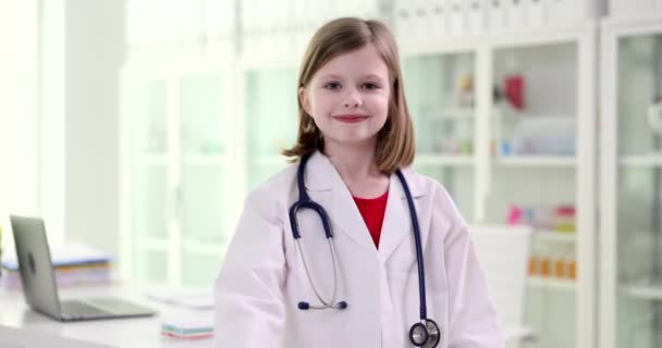 Smiling Little Beautiful Girl Doctor Costume Showing Thumb Recommendation Pediatric — Video Stock