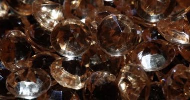 Large number of expensive real light brown diamonds. Assessment of quality of gemstones