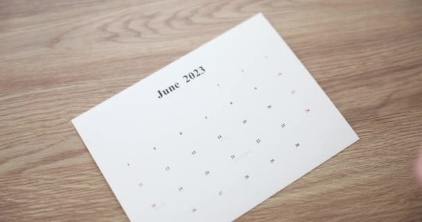 Woman Hand Puts Sheets Calendar Months 2023 Table Agenda Time — Stockvideo