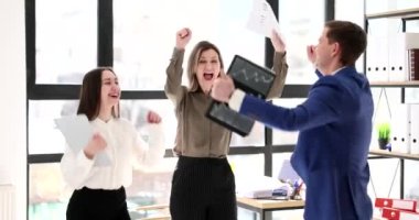 Happy excited scream with joy jump raise their hands. Business team of joyful professionals rejoicing, celebrating good sales results