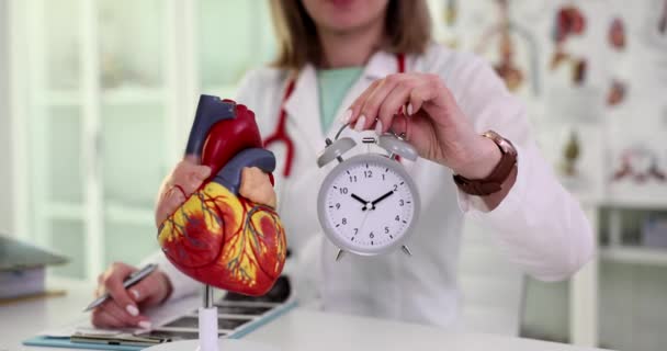 Cardiologist Doctor Holding Heart Alarm Clock Cardiology Heart Time Treatment — Stok video