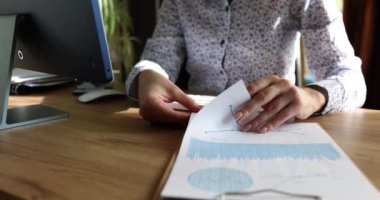 Woman hands with business analytics documents in office closeup. Analytics statistics and business development work planning