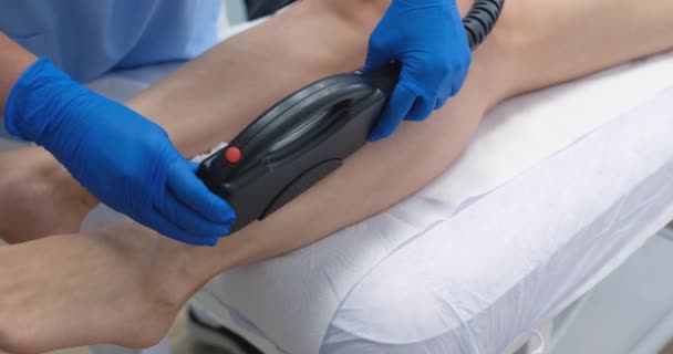 Beautician Makes Laser Hair Removal Legs Woman Salon Types Laser — Vídeos de Stock