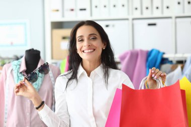 Beautiful happy young woman with shopping bags. Shopping sale discounts and bargains