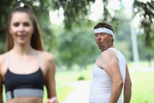 Man Jealous Beautiful Running Woman Looks Ass Park Fitness Sport — Fotografia de Stock