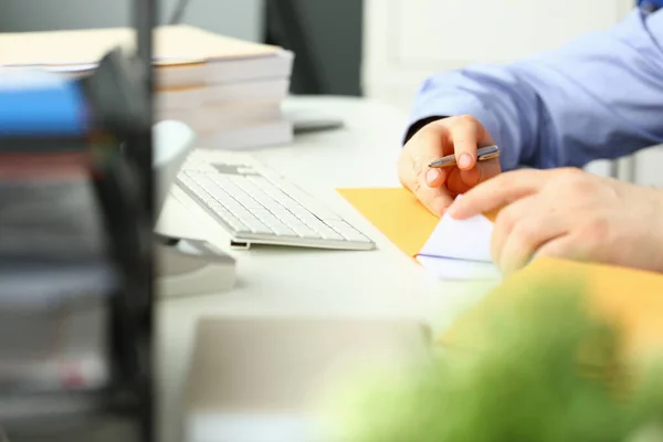 Businessman Sitting Table Office Holding Yellow Envelope Taking Out Sheet — Stok fotoğraf