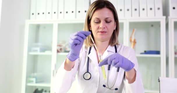 Doctor Holds Test Tube Urine Sample Test Strip Analysis Closeup — Stock Video