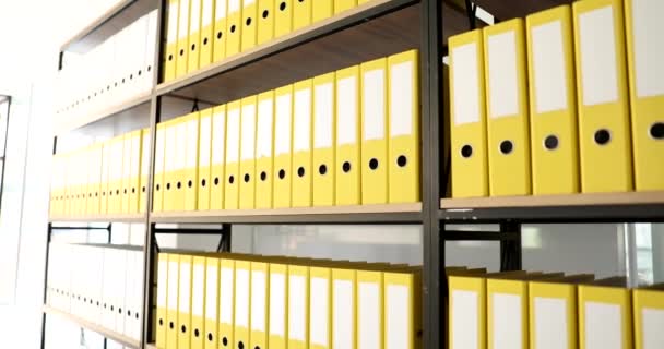 Identical Yellow Folders Shelf Archive Work Documents Database Storage — Stock Video