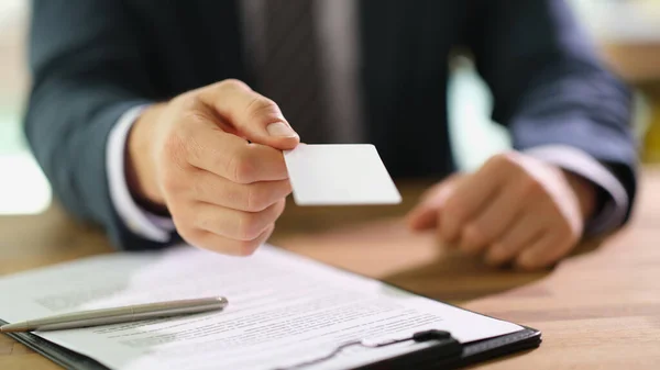 stock image Manager handing out business card to client at work in office closeup. Exchanging contacts on meeting concept