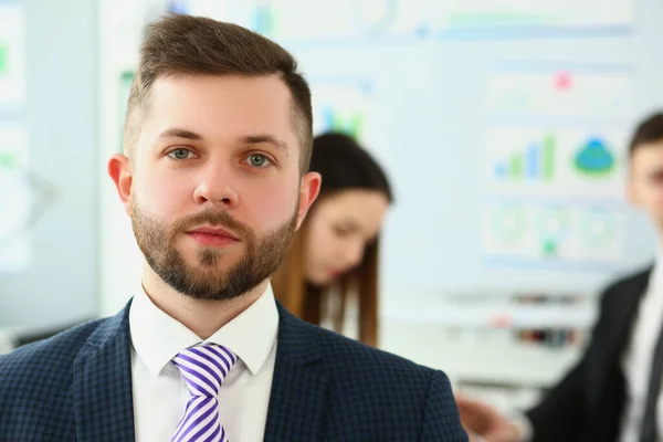 stock image Portrait of serious businessman in background business partners colleagues. Successful career leader or boss in office