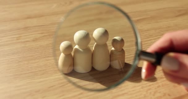 Magnifying Glass Looks Wooden Figurines Family Traditional Family Values Unity — Stock Video