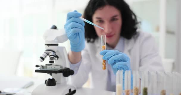 Laboratory Assistant Scientist Drips Liquid Test Tube Corn Scientist Studying — Stock Video