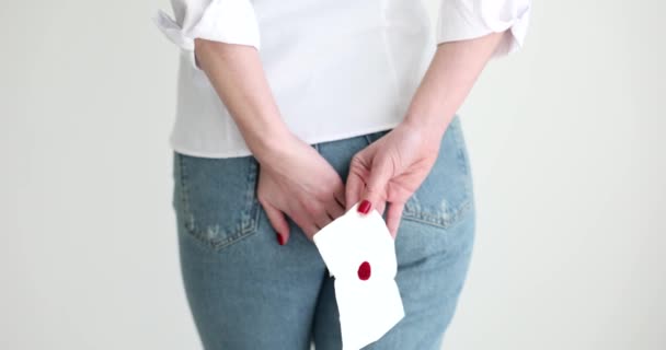 Woman Holding Rectal Area Bloody Toilet Paper Back View Movie — Stock Video