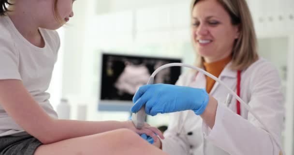 Positive Doctor Checks Wrist Little Girl Ultrasound Transducer Specialist Smiles — Stock Video