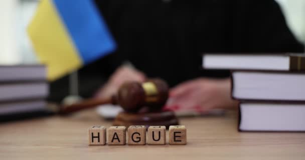 Word Hague Made Wooden Cubes Judge Writing Document Lawyer Investigates — Stock Video