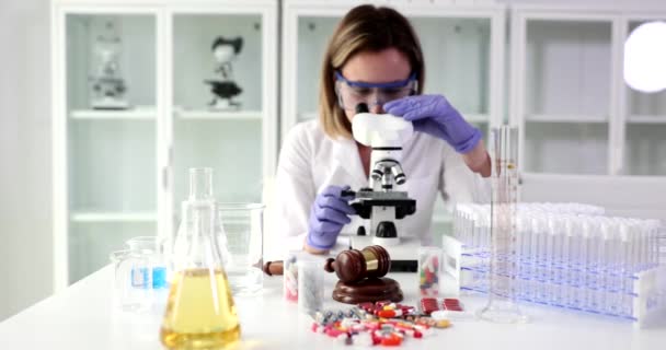 Forensic Expert Looks Microscope Examines Cosmetic Products Laboratory Quality Control — Stock Video