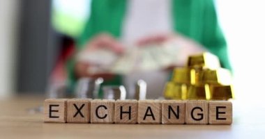 Kelimelerle ahşap küplerin altın külçelerin bozuk paralarla ve dolarlarla yer değiştirdiği bir kelime. Finansal varlıkları alıp satmak