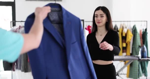 Dry Cleaning Worker Accepts Suit Customer Laundry Ironing Services — Stock Video