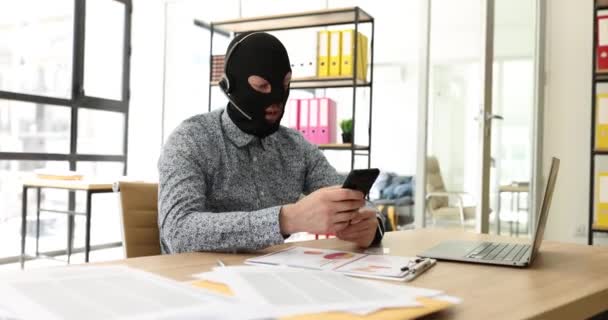 Male Thief Balaclava Headphones Microphone Phone Office Cybercrime Phone Scammers — Stock Video