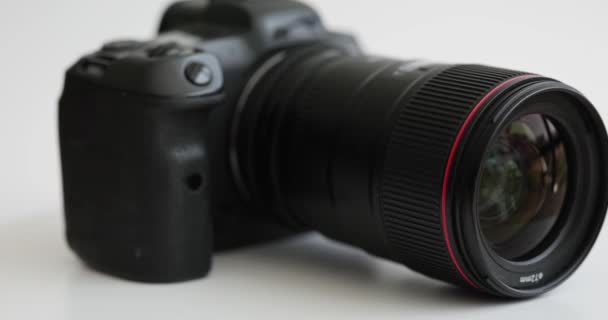 Black Professional Photo Camera Spinning White Background Closeup Movie Hobby — Stock Video
