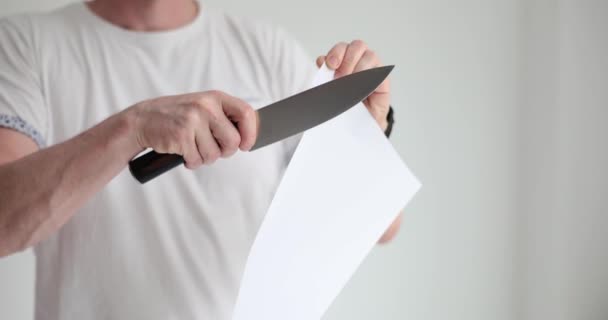 Man Demonstrates Sharpness Knife Cutting Thin Sheet Paper Razor Sharp — Stock Video