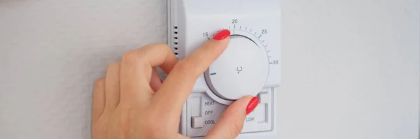 Woman Hand Adjusts Turns Wall Temperature Controller Controller Button Climate — Zdjęcie stockowe