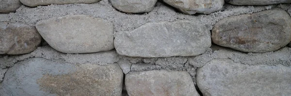 きれいに積層ラフカット石壁シームレスなテクスチャの背景 石のコンセプトから古い石造りの建物 — ストック写真