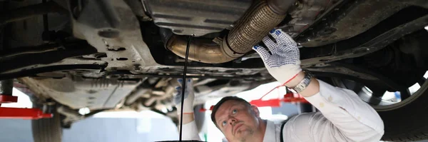Handsome Auto Mechanic Checks Undercarriage Car Service Station Male Worker — Foto Stock