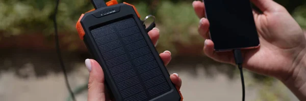 Hands Holding Mobile Phone External Battery Connected Solar Battery Closeup — 스톡 사진